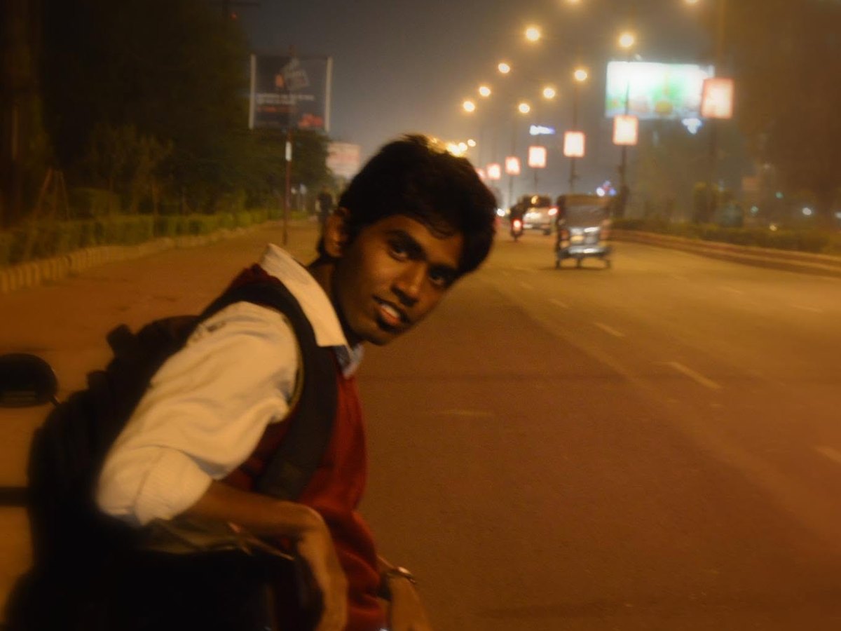 Me on a bike on a Nagpur road at night