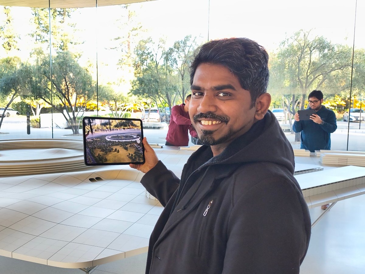 Me holding an iPad at a visitor center